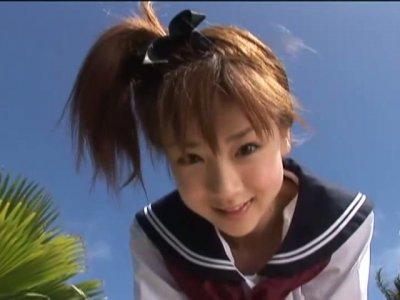 Japanese teen Aki Hoshino plays outside in the sailor outfit