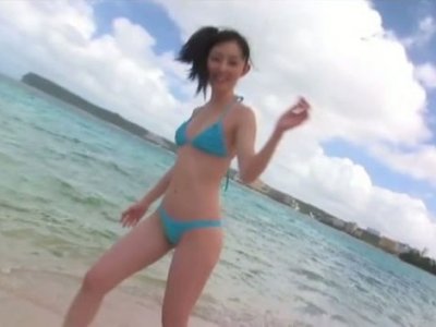 Spunked girlie Rina Akiyama goes to the beach to show her splendid body